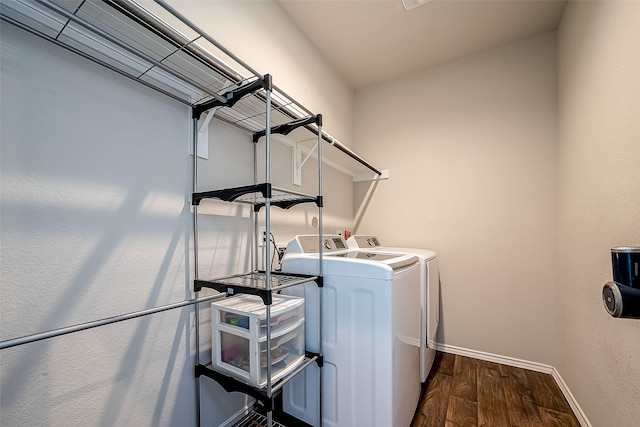 18623 Swainboro Dr, New Caney, TX 77357 - laundry room featuring washer and dryer and dark wood-type flooring