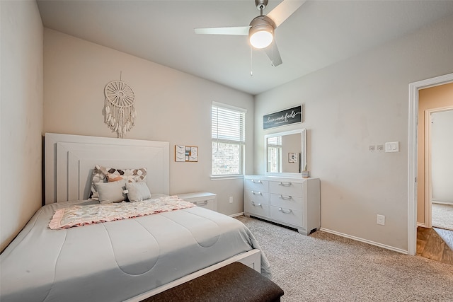 18623 Swainboro Dr, New Caney, TX 77357 - carpeted bedroom with baseboards and a ceiling fan