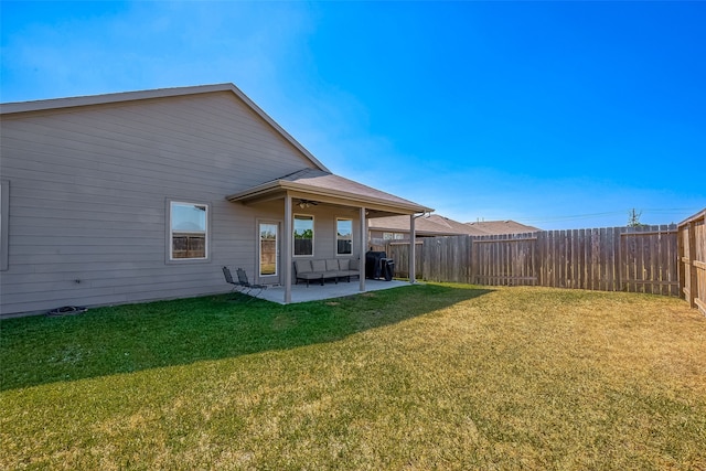 18623 Swainboro Dr, New Caney, TX 77357 - fenced backyard with a patio and a ceiling fan