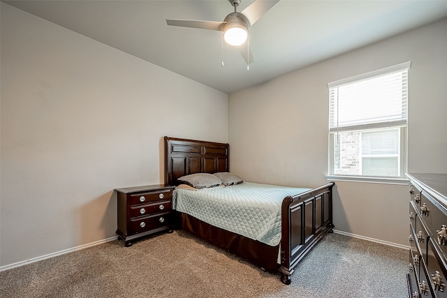18623 Swainboro Dr, New Caney, TX 77357 - carpeted bedroom with baseboards and ceiling fan
