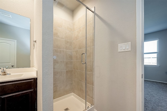 18623 Swainboro Dr, New Caney, TX 77357 - full bath with a shower stall, vanity, and a textured wall
