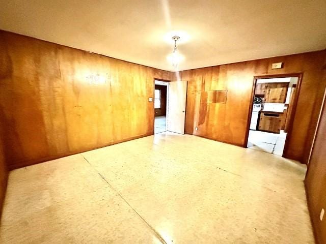 515 Vaky St, Corpus Christi, TX 78404 - unfurnished room featuring wood walls