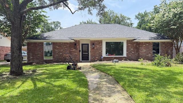 10047 Meadow Lake Ln, Houston, TX 77042 - ranch-style house with a front lawn, brick siding, and roof with shingles