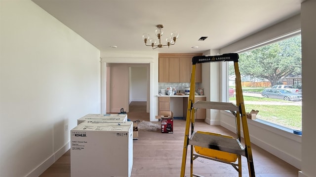 10047 Meadow Lake Ln, Houston, TX 77042 - dining space with a chandelier and light wood finished floors