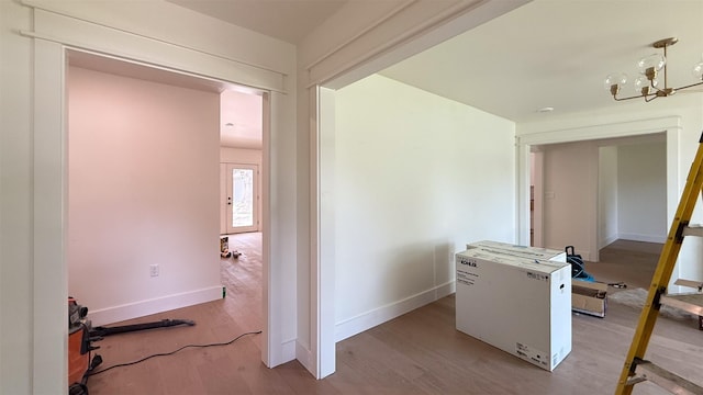 10047 Meadow Lake Ln, Houston, TX 77042 - hall with a chandelier and wood finished floors