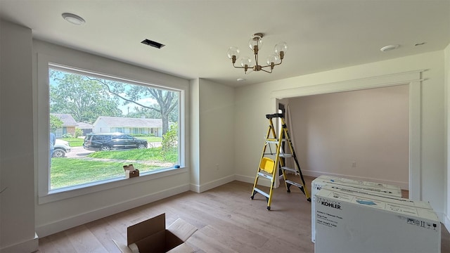 10047 Meadow Lake Ln, Houston, TX 77042 - bedroom featuring a chandelier and light wood-style floors