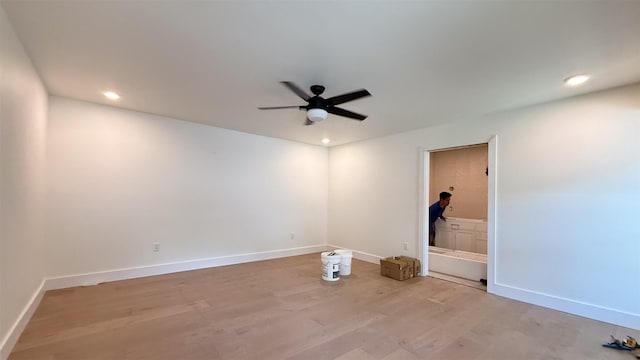 10047 Meadow Lake Ln, Houston, TX 77042 - spare room with light wood-type flooring, a ceiling fan, and recessed lighting