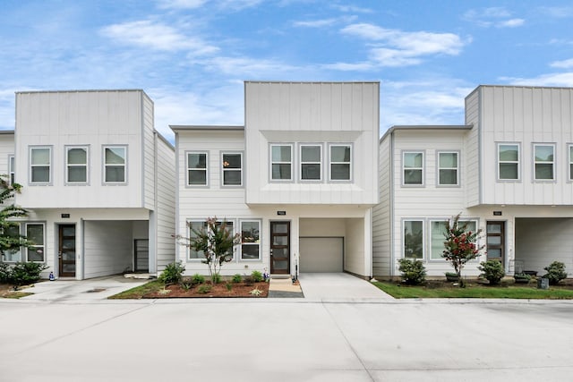9016 Lonestar River Ln, Houston, TX 77080 - contemporary house with a garage, driveway, and board and batten siding
