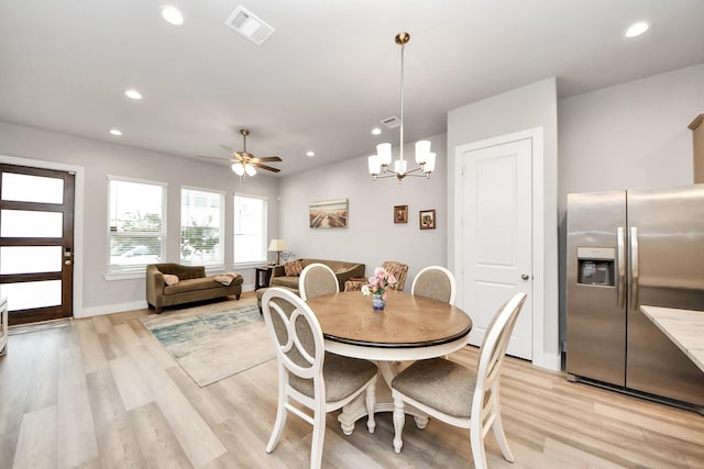 9016 Lonestar River Ln, Houston, TX 77080 - dining room with recessed lighting, light wood-style floors, a chandelier, and a ceiling fan