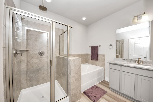 9016 Lonestar River Ln, Houston, TX 77080 - full bathroom with vanity, a bath, a stall shower, and recessed lighting