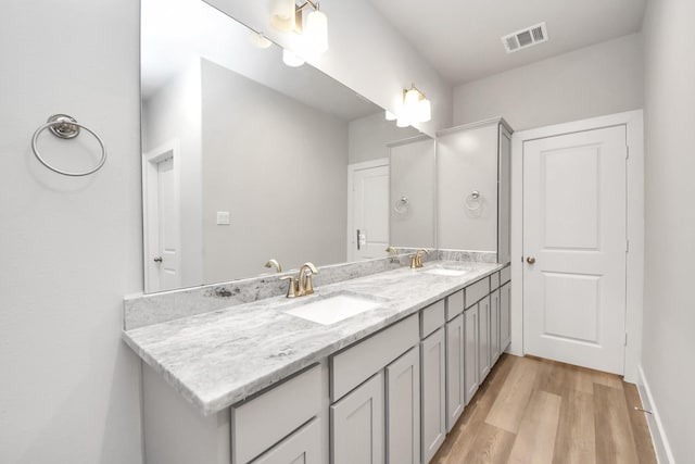 9016 Lonestar River Ln, Houston, TX 77080 - full bathroom featuring double vanity and wood finished floors