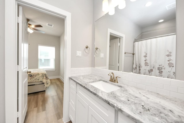 9016 Lonestar River Ln, Houston, TX 77080 - ensuite bathroom with vanity, wood finished floors, recessed lighting, ceiling fan, and curtained shower