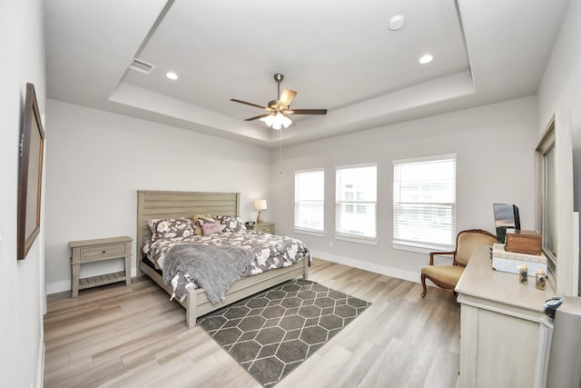 9016 Lonestar River Ln, Houston, TX 77080 - bedroom featuring a tray ceiling, light wood-type flooring, recessed lighting, and ceiling fan