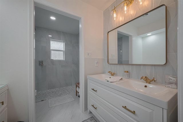 7634 Braesdale Ln, Houston, TX 77071 - full bath with double vanity, tiled shower, marble look tile flooring, and recessed lighting