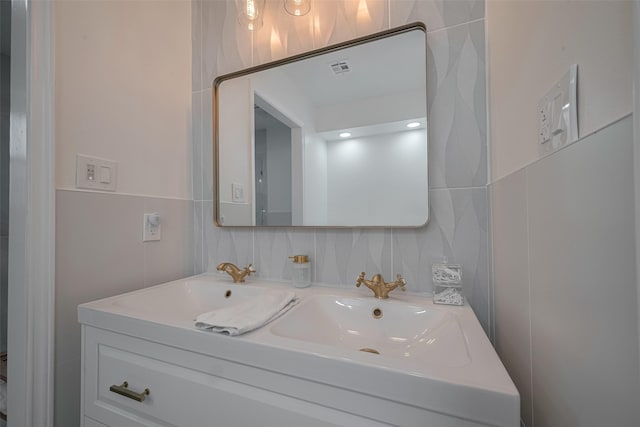 7634 Braesdale Ln, Houston, TX 77071 - bathroom with double vanity and tile walls