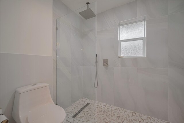 7634 Braesdale Ln, Houston, TX 77071 - bathroom with tile walls and walk in shower