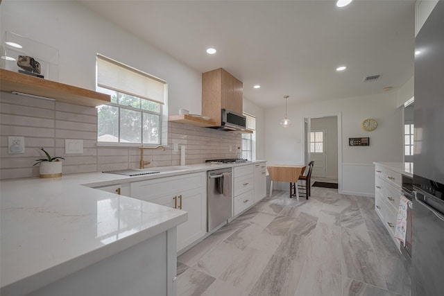 7634 Braesdale Ln, Houston, TX 77071 - kitchen with open shelves, stainless steel appliances, backsplash, white cabinetry, and light marble finish flooring