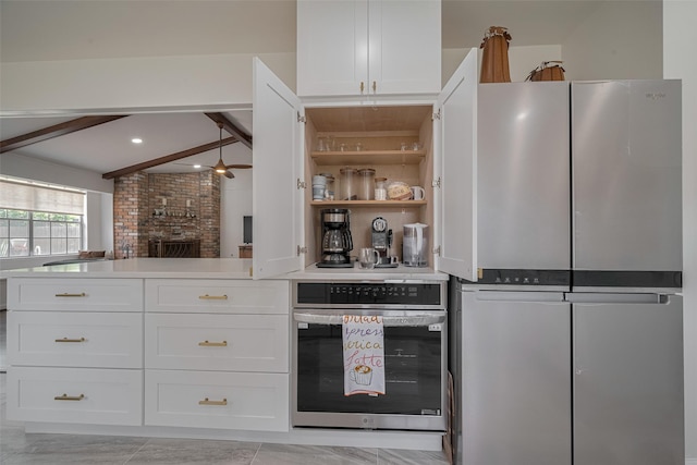 7634 Braesdale Ln, Houston, TX 77071 - kitchen featuring oven, white cabinetry, and light countertops