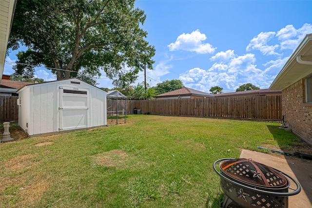 7634 Braesdale Ln, Houston, TX 77071 - fenced backyard with a storage shed and a fire pit