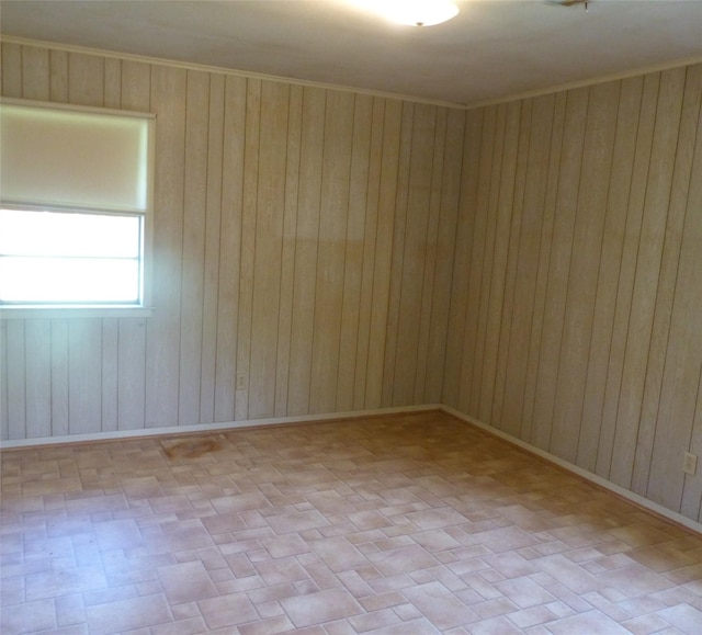 415 N Atchison St, Sealy, TX 77474 - spare room featuring wood walls and brick patterned flooring