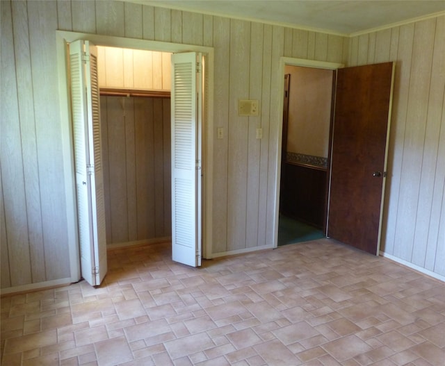 415 N Atchison St, Sealy, TX 77474 - unfurnished bedroom with wooden walls and a closet