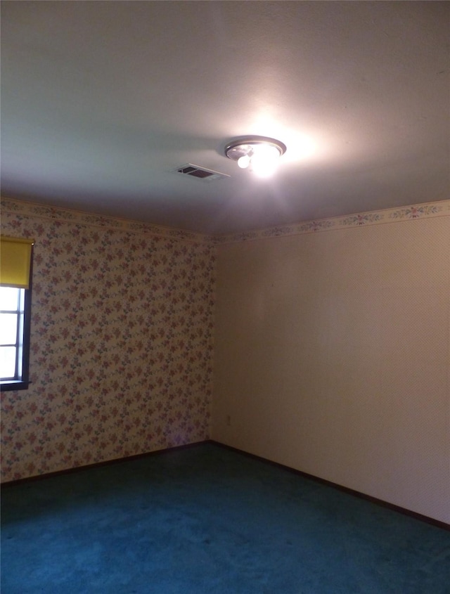 415 N Atchison St, Sealy, TX 77474 - empty room with dark colored carpet
