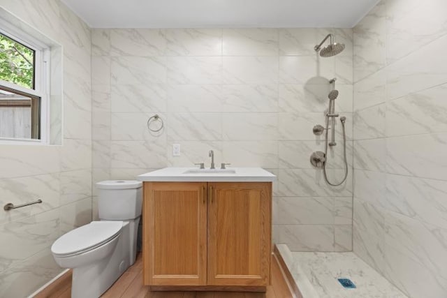 4406 Merwin St, Houston, TX 77027 - full bathroom featuring vanity, tiled shower, and tile walls