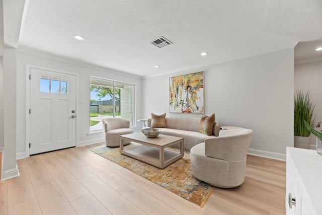 4406 Merwin St, Houston, TX 77027 - living room with light wood finished floors, recessed lighting, and ornamental molding