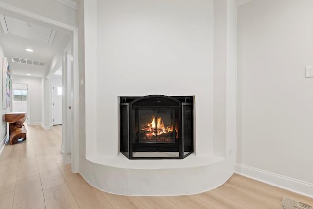4406 Merwin St, Houston, TX 77027 - detailed view of wood finished floors and a glass covered fireplace
