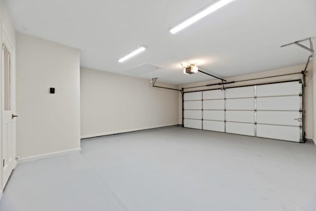 4406 Merwin St, Houston, TX 77027 - garage featuring a garage door opener and baseboards