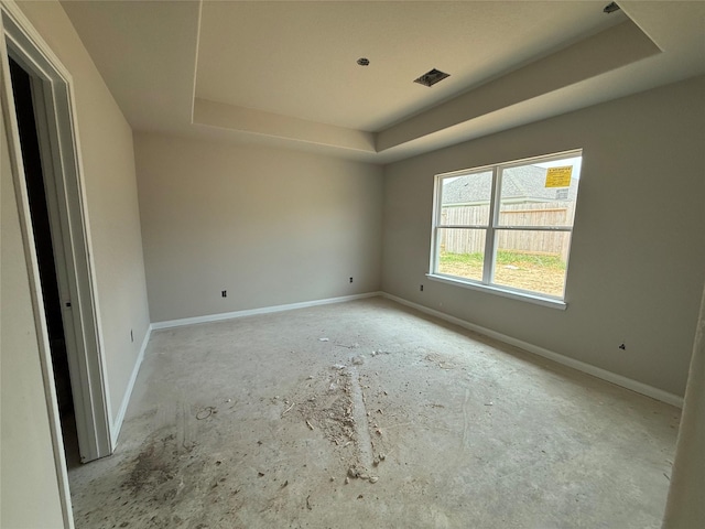 2541 Hawks Eye Dr, Conroe, TX 77301 - spare room featuring a raised ceiling and baseboards