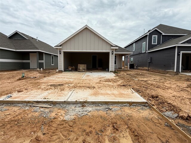 2528 Hawks Eye Dr, Conroe, TX 77301 - view of front of house featuring board and batten siding, an attached garage, and concrete driveway