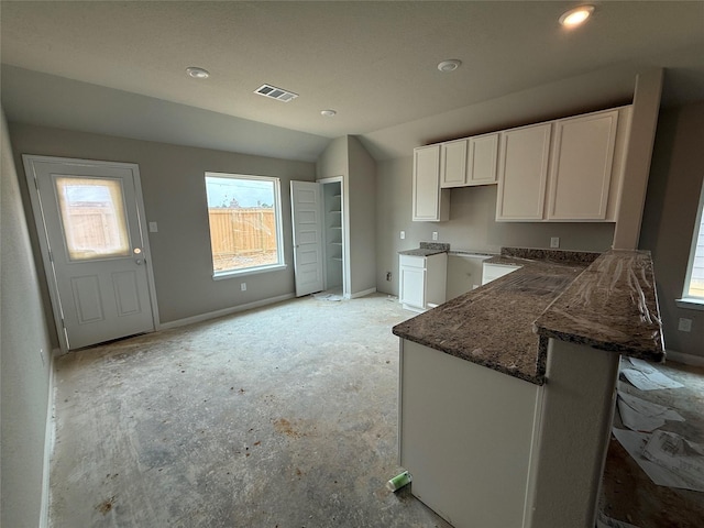 2528 Hawks Eye Dr, Conroe, TX 77301 - kitchen with white cabinets, recessed lighting, and lofted ceiling