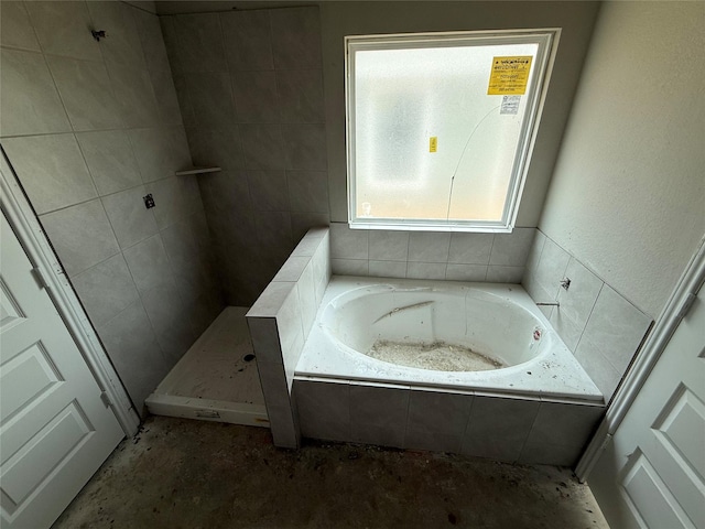 2528 Hawks Eye Dr, Conroe, TX 77301 - full bathroom with a garden tub and tiled shower
