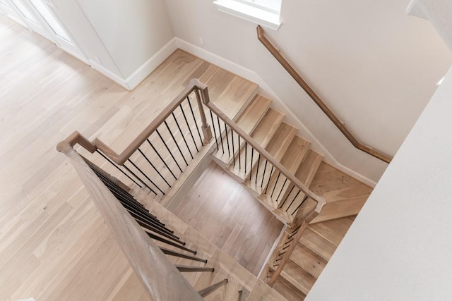 819 Bringhurst, Houston, TX 77020 - staircase with baseboards and wood finished floors