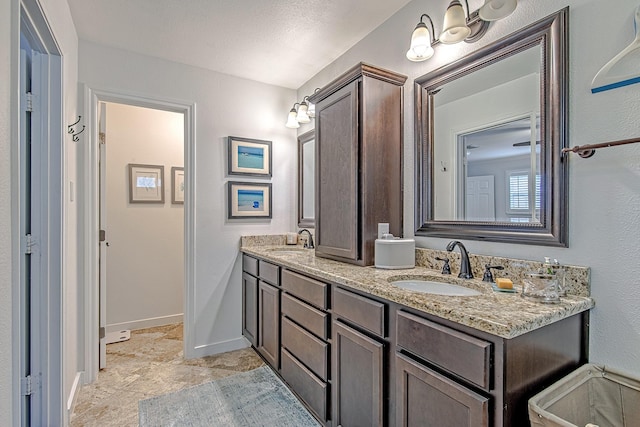 520 W 30th St, Houston, TX 77018 - bathroom featuring double vanity and baseboards