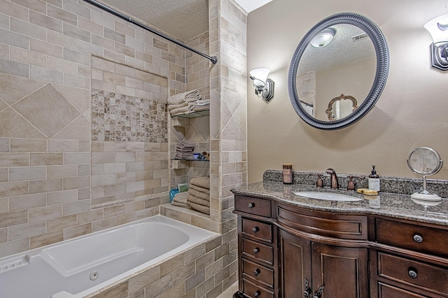 520 W 30th St, Houston, TX 77018 - bathroom featuring vanity, a textured ceiling, and tiled shower / bath