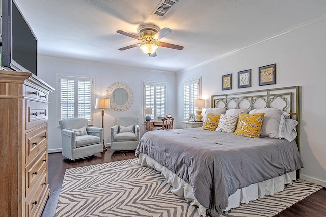 520 W 30th St, Houston, TX 77018 - bedroom featuring dark wood-style floors, ornamental molding, and a ceiling fan