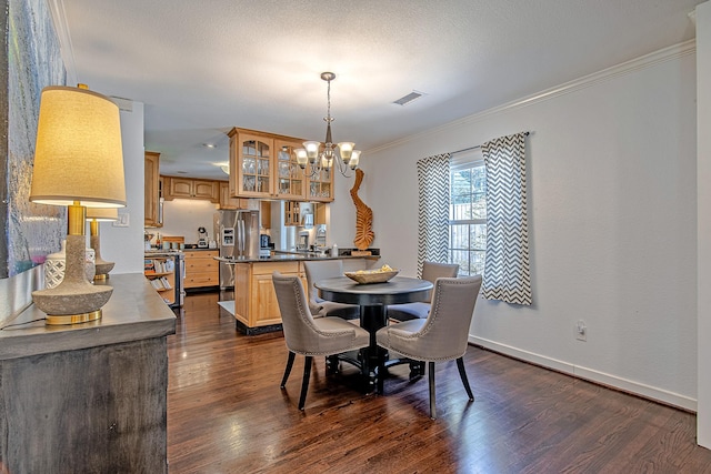 520 W 30th St, Houston, TX 77018 - dining room with a chandelier, dark wood-style floors, and crown molding