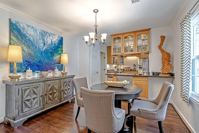 520 W 30th St, Houston, TX 77018 - dining area featuring a chandelier, dark wood-type flooring, and ornamental molding