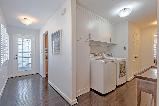 520 W 30th St, Houston, TX 77018 - washroom with washer and clothes dryer, dark wood-style flooring, and cabinet space