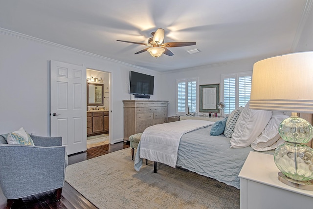 520 W 30th St, Houston, TX 77018 - bedroom with crown molding, dark wood-style flooring, connected bathroom, and a ceiling fan