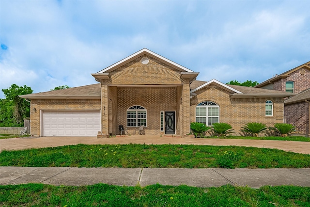 2403 Ranna Ct, Sugar Land, TX 77498 - view of front of house featuring brick siding, an attached garage, and driveway