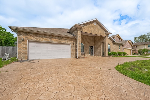 2403 Ranna Ct, Sugar Land, TX 77498 - view of front of house with brick siding, an attached garage, driveway, and roof with shingles