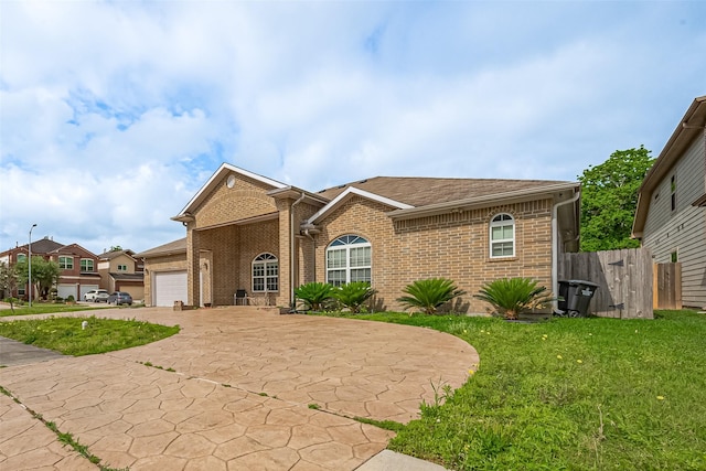 2403 Ranna Ct, Sugar Land, TX 77498 - view of front of house with brick siding, an attached garage, and driveway
