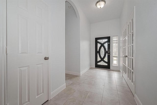 2403 Ranna Ct, Sugar Land, TX 77498 - entrance foyer featuring arched walkways and light tile patterned floors