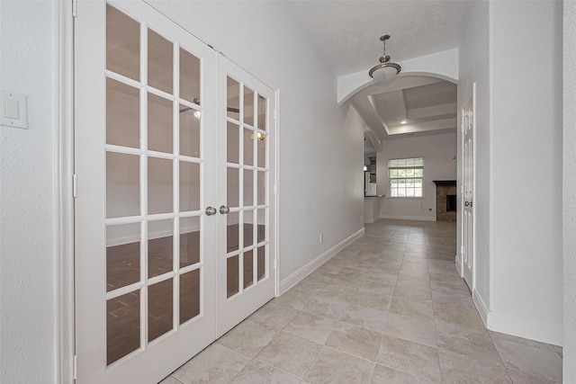 2403 Ranna Ct, Sugar Land, TX 77498 - hall featuring arched walkways, french doors, and tile patterned flooring