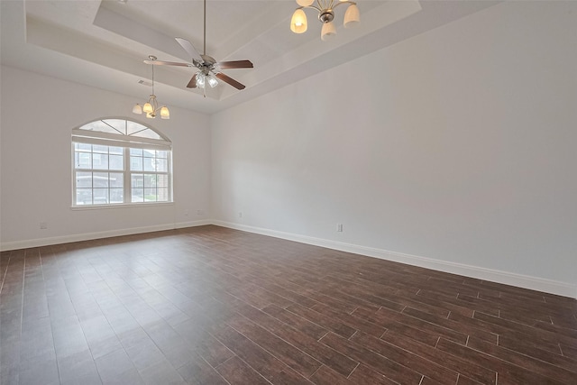 2403 Ranna Ct, Sugar Land, TX 77498 - unfurnished room featuring a chandelier, a tray ceiling, dark wood-style floors, and ceiling fan