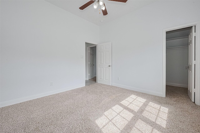 2403 Ranna Ct, Sugar Land, TX 77498 - unfurnished bedroom with carpet, a spacious closet, a high ceiling, and a ceiling fan