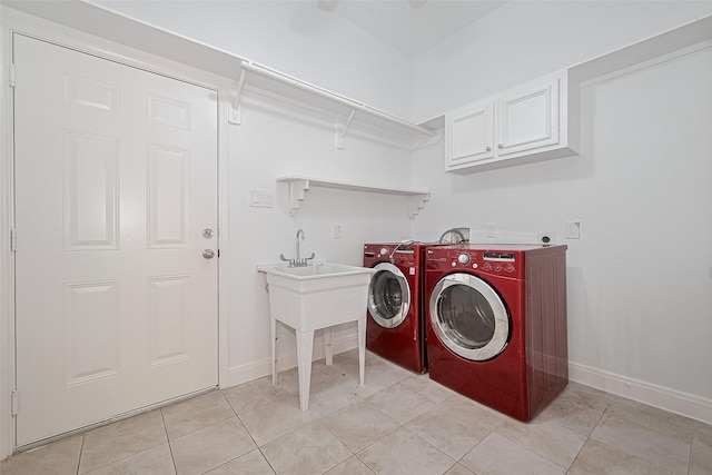 2403 Ranna Ct, Sugar Land, TX 77498 - washroom with cabinet space, independent washer and dryer, and light tile patterned flooring